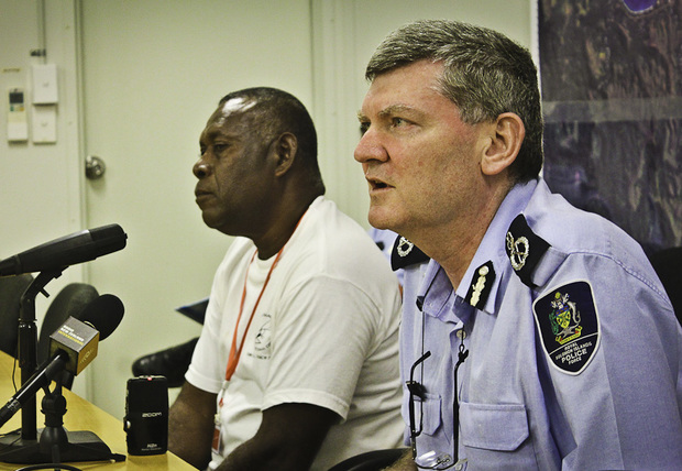 The Former Solomon Islands Police Commissioner Frank Prendergast, (foreground).