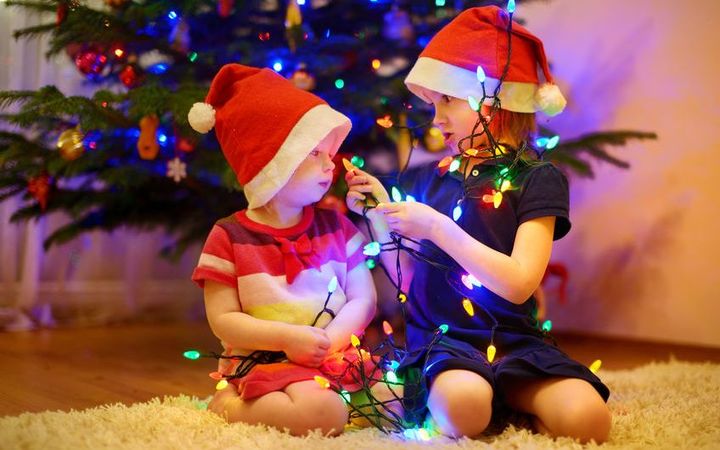 Christmas lights, tree and children.