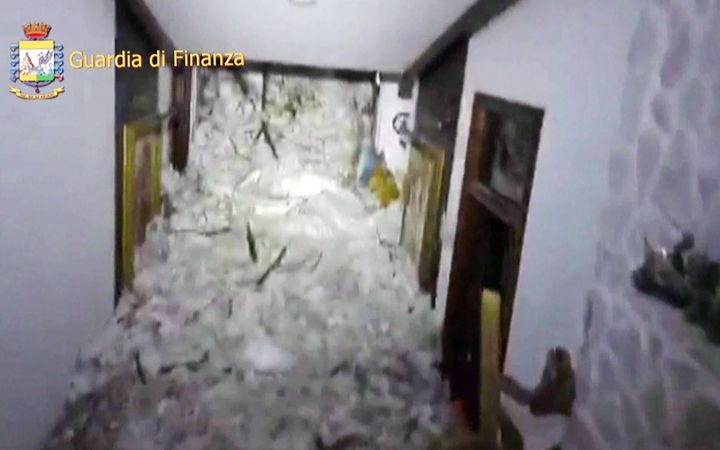  A wall of snow inside the Hotel Rigopiano, shown on a screen grab from a police video.