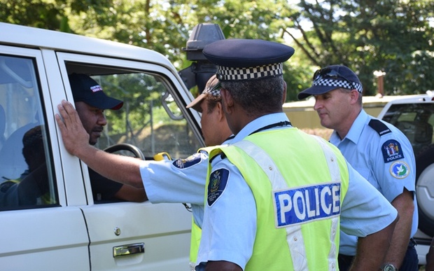 Solomon Islands traffic police learning to use the new breathalyzer kits.