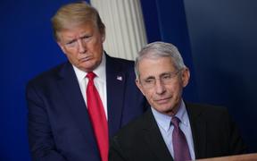 Director of the National Institute of Allergy and Infectious Diseases Anthony Fauci, flanked by US President Donald Trump, speaks during the daily briefing on the novel coronavirus, which causes COVID-19, in the Brady Briefing Room of the White House on April 22, 2020, in Washington, DC. 