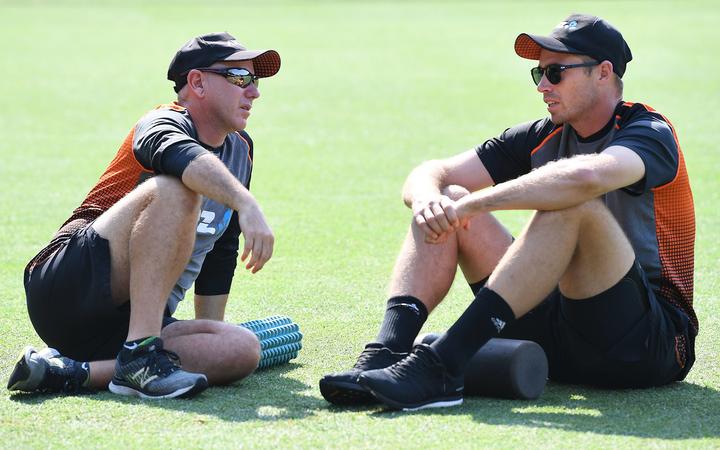 Black Caps coach Gary Stead and bowler Tim Southee chat before play on day two of the third Test against Australia in Sydney.