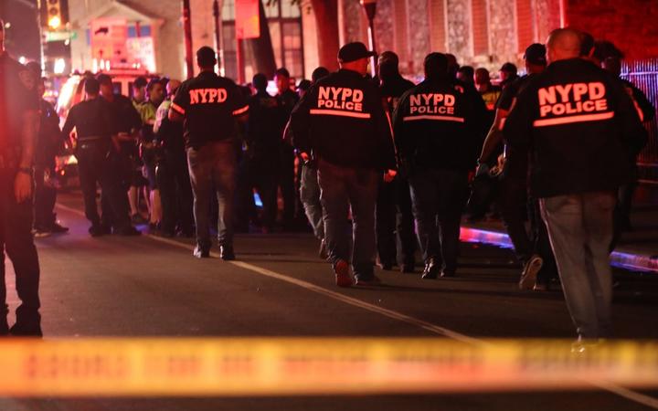 NEW YORK, NEW YORK - JUNE 03: Police gather at the scene where two New York City police officers were shot in a confrontation late Wednesday evening in Brooklyn on June 03, 2020 in New York City.
