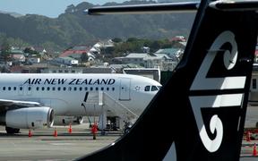 An Air New Zealand airplane wait for passengers at Wellington International airport on February 20, 2020. 
