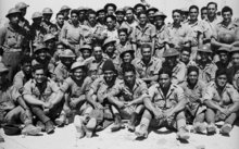 The 28th Maori Battalion at a transit camp in Egypt on the morning after their evacuation from Crete, June 1941.