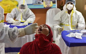 A girl gets tested for Covid-19 in Kolkata.