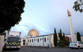 A police vehicle (L) is seen parked by the Al-Noor Mosque ahead of the last day of the sentencing hearing for Brenton Tarrant, the gunman who massacred 51 people during last year's twin mosque attacks, in Christchurch on August 27, 2020.