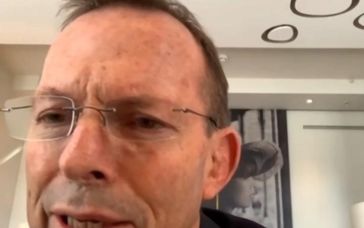 A video grab from footage broadcast by the UK Parliament's Parliamentary Recording Unit (PRU) shows Australian former prime minister Tony Abbott speaking to the Foreign Affairs Committee by remote video feed.