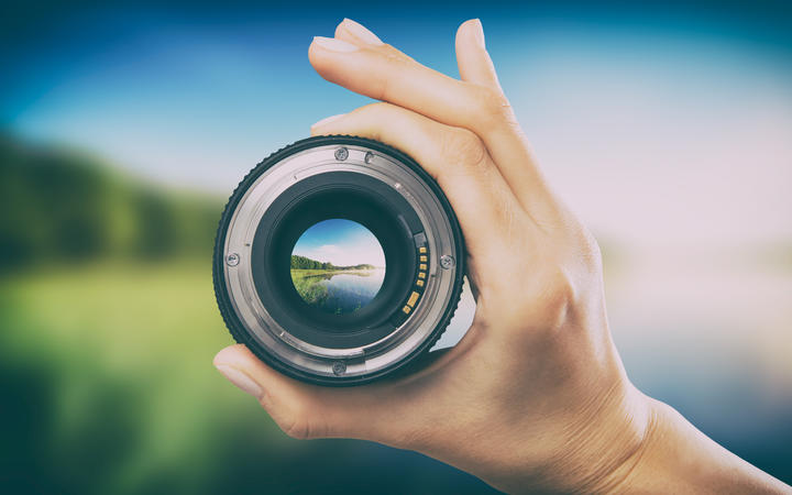 photography view camera photographer lens lense through video photo digital glass hand blurred focus people concept - stock image