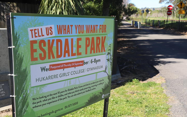 A council ad outside the park for an upcoming community meeting