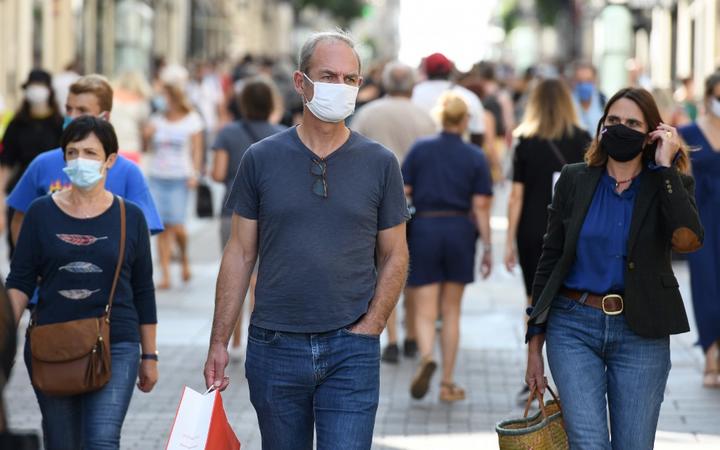 People wearing face masks, to curb the spread of Covid-19 in Nantes, western France.