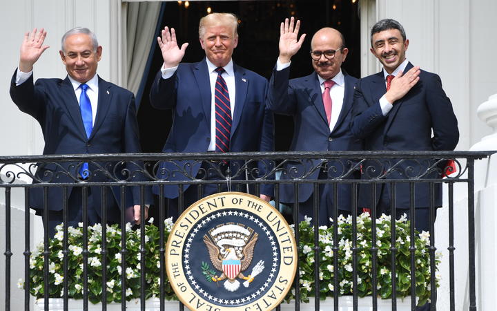 Israeli Prime Minister Benjamin Netanyahu, US President Donald Trump, Bahrain Foreign Minister Abdullatif al-Zayani, and UAE Foreign Minister Abdullah bin Zayed Al-Nahyan wave from the Balcony at the White House in Washington on 15 September, 2020.