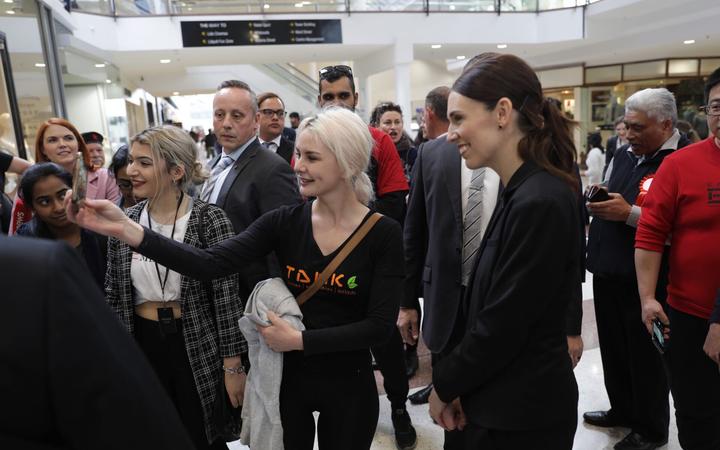 Labour Party leader Jacinda Ardern taking a selfie with a member of the public while campaigning in Hamilton on 23 September, 2020.