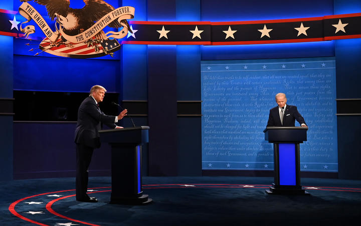 US President Donald Trump (L) and Democratic Presidential candidate and former US Vice President Joe Biden exchange arguments during the first presidential debate at the Case Western Reserve University and Cleveland Clinic in Cleveland, Ohio on September 29, 2020. (Photo by Jim WATSON / AFP)