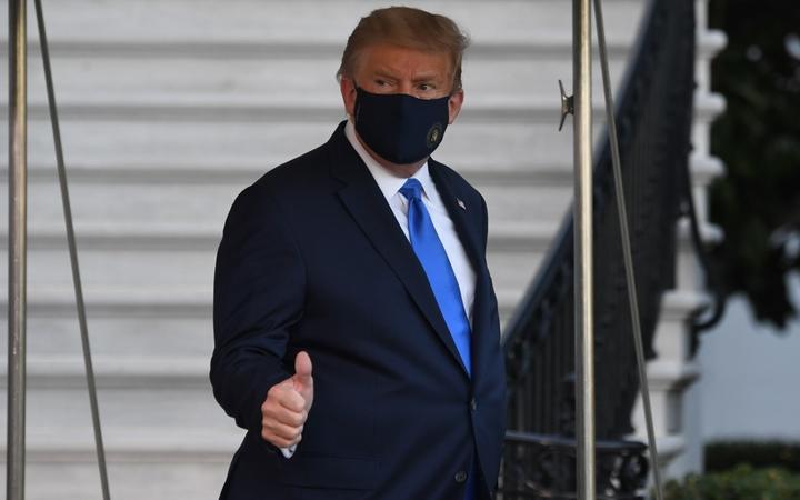 US President Donald Trump walks to Marine One prior to departure from the South Lawn of the White House in Washington, DC, October 2, 2020, as he heads to Walter Reed Military Medical Center, after testing positive for Covid-19.