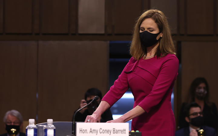 Supreme Court nominee Judge Amy Coney Barrett takes her seat after a break in the Senate Judiciary Committee confirmation hearing on Capitol Hill on October 12, 2020 in Washington, DC. 