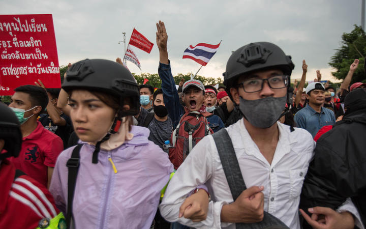 Pro-democracy protesters march toward  Government House during an anti government demonstration on October 14, 2020 in Bangkok, Thailand. 