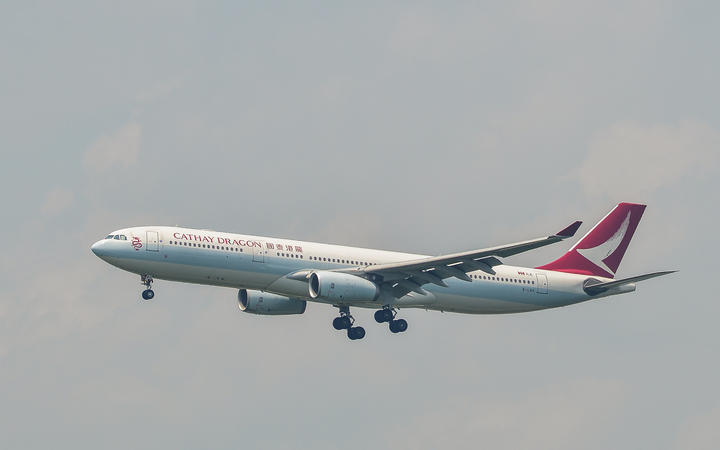 An Airbus A330-300 airplane of Cathay Dragon landing.