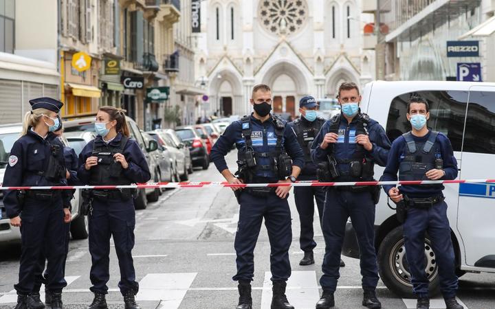 Police block the access to the Notre-Dame de l'Assomption Basilica in Nice on October 29, 2020 after a knife-wielding man kills three people at the church,
