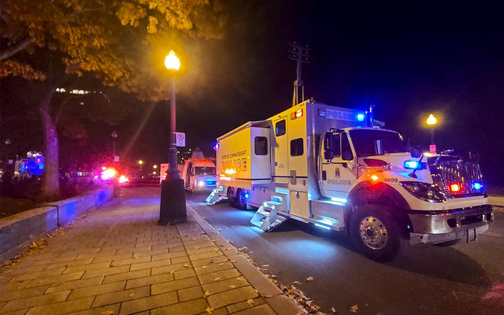 A police truck parked near the National Assembly of Quebec, in Quebec City, early on 1 November, 2020, after two people were killed and five wounded ina sword attack.