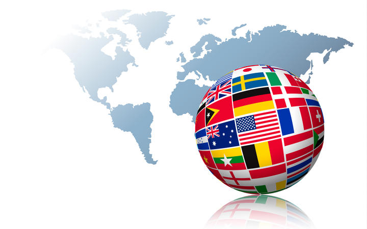 Globe made out of flags on a world map background. Vector.
