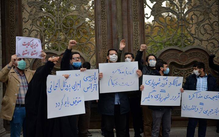 TEHRAN, IRAN - NOVEMBER 28: A group of demonstrator gather to protest gathering against the assassination of the Iranian Top nuclear scientist  Mohsen Fakhrizadeh Mahabadi, in southern Tehran, Iran on November 28, 2020. 