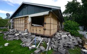 Damage to a house is seen in Waiau town, some 80 kms to the south of Kaikoura, on November 16, 2016, after an earthquake hit New Zealand on Monday. 