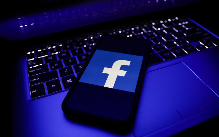 Facebook logo is seen displayed on a phone screen in this illustration photo taken in November 2020 