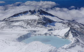 Aerial of a tuquoise crater lake on top of Mount Ruapehu, Tongariro National Park, UNESCO World Heritage Site, North Island, New Zealand, Pacific