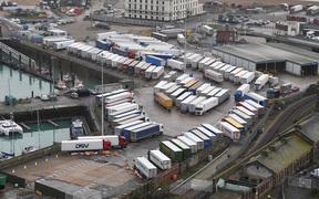 Freight lorries are seen parked at Dover Marina in Kent, south east England on December 22, 2020, adjacent to the Port of Dover as queuing trucks wait to continue their journeys after France closed its borders to accompanied freight arriving from the UK 