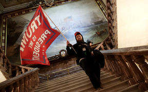 A protester holds a Trump flag inside the US Capitol Building near the Senate Chamber on January 06, 2021 in Washington, DC. 