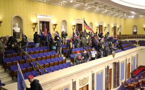 Protesters enter the Senate Chamber on January 06, 2021 in Washington, DC. 