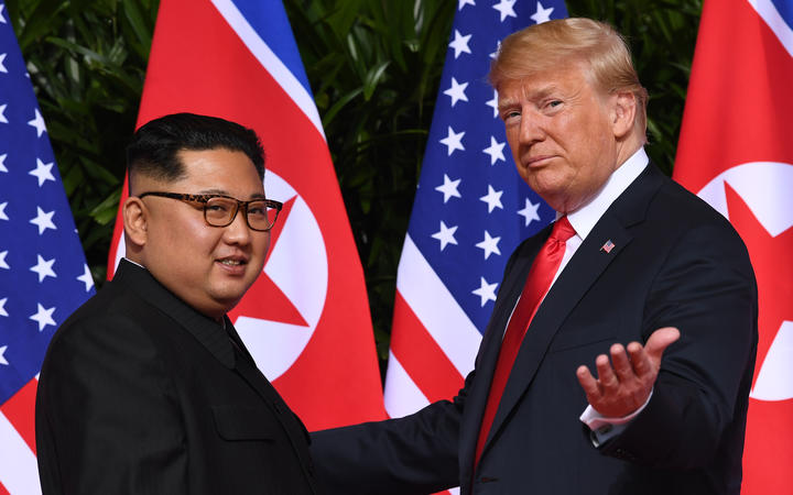 Donald Trump (right) meets with North Korea's leader Kim Jong Un at the start of their US-North Korea summit in June 2018.