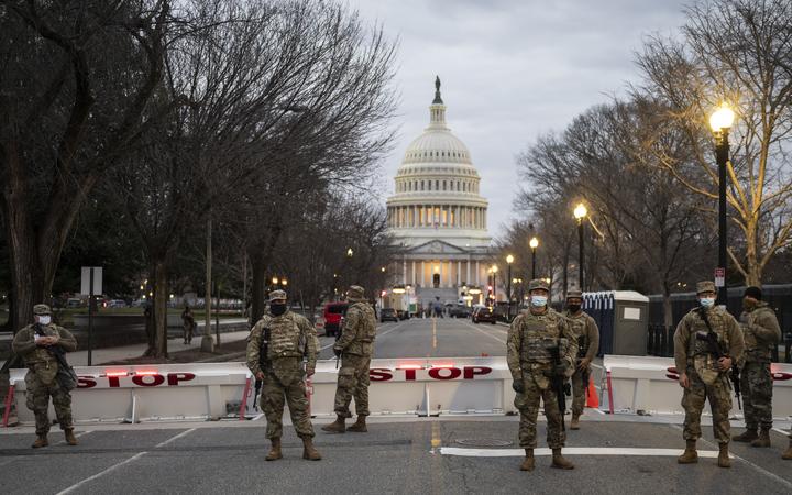 Members of the US National Guard stand watch at the US Capitol in Washington, DC on January 17, 2021, during a nationwide protest called by anti-government and far-right groups supporting US President Donald Trump and his claim of electoral fraud in the November 3 presidential election. 