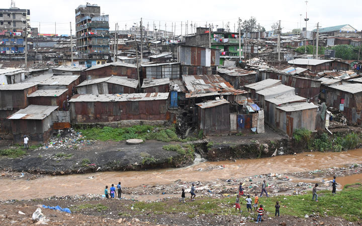 Children play next to Nairobi river in the Mathare valley slum in Nairobi, Kenya. File photo
