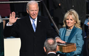 Joe Biden, alongside incoming US First Lady Jill Biden, is sworn in as the 46th US President by Supreme Court Chief Justice John Roberts.