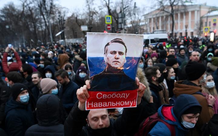 Protesters march in support of jailed opposition leader Alexei Navalny in downtown Moscow on January 23, 2021. 