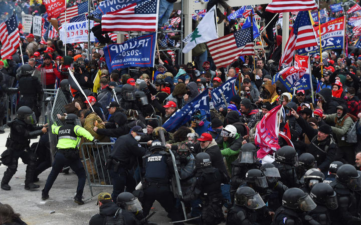 Trump supporters clash with police and security forces at the US Capitol on 6 January 2021.