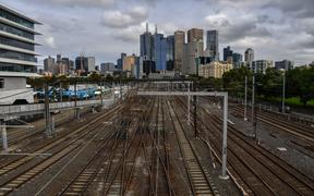 A general view shows train tracks next to Melbourne Park on day six of the Australian Open tennis tournament in Melbourne on 13 February 
