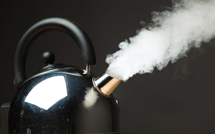 boiling kettle with dense steam