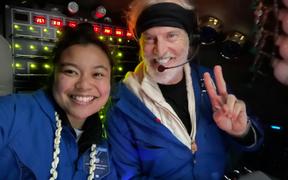 Inside the submersible Limiting Factor close to the ocean floor, Nicole Yamase and pilot/owner Victor Vescovo 