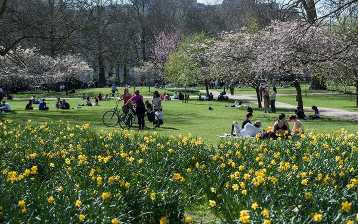 People enjoy exceptionally warm and sunny weather in St James's Park, making the most of eased Coronavirus restrictions, on 30 March, 2021 in London, England. 