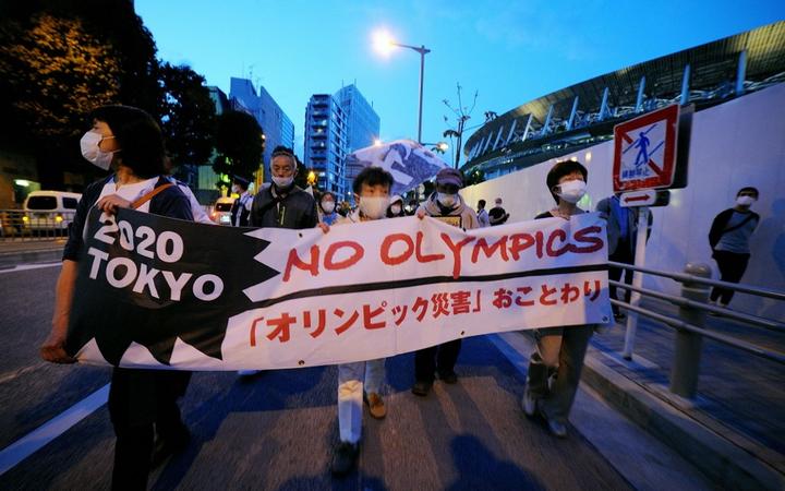 TOKYO, JAPAN - MAY 09: People stage a demonstration as they demand Tokyo Olympics to cancelled due to coronavirus pandemic in Tokyo, Japan on May 9, 2021. 