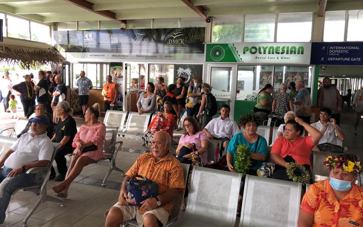 People waiting at the airport in Rarotonga on the first day of the travel bubble with New Zealand.