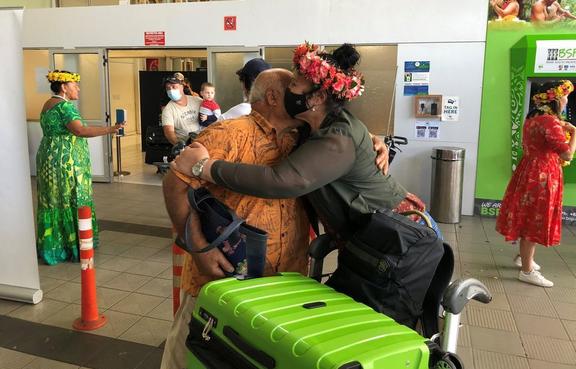 The airport at Avarua was packed with family and friends waiting for the first arrivals.