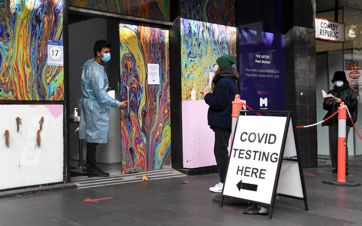 People wait in queues at a Covid-19 testing centre in Melbourne on 26 May 2021, as Australia's second biggest city scrambles to contain a growing Covid outbreak. 