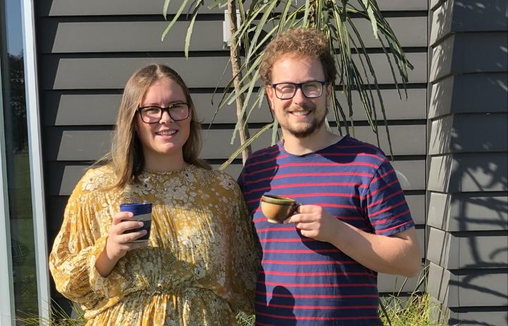 Jono Broom of Bean Merchant enjoys a cuppa with his partner Maddie Hullena.