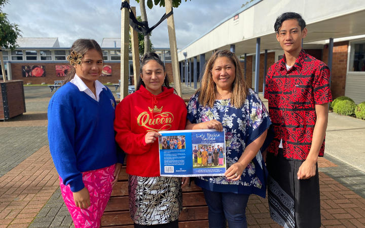 Tangaroa College students, from left, Petala Nanai, Fipule Tanavasa, and Togisau Chan Sau, with their English teacher Debbie Riley holding the cover of their book.