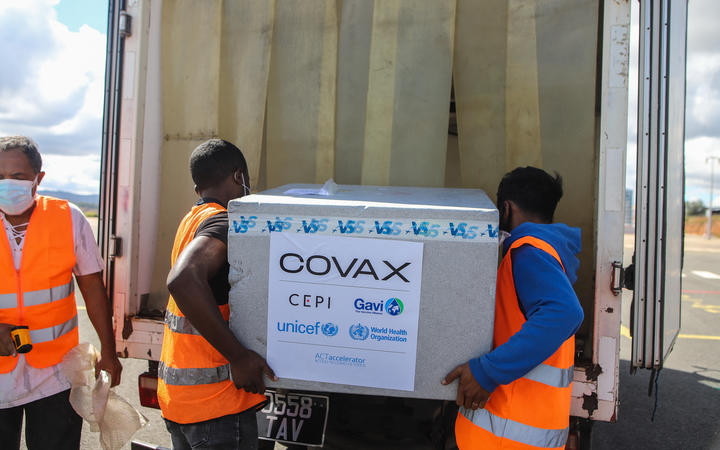Workers load boxes of Oxford/AstraZeneca Covid-19 vaccines, part of the the Covax programme, into a truck after they arrived by plane at the Ivato International Airport in Antananarivo, Madagascar, on May 8, 2021. 
