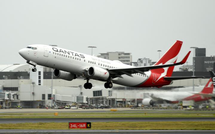 A Qantas plane takes off from the Sydney International airport on 6 May 2021.